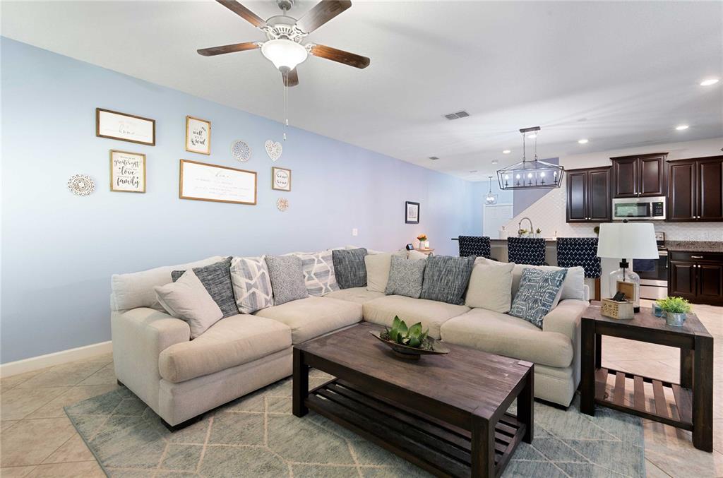 17365 Old Tobacco Road Lutz, FL 33558 - Photo 5 of 44 a living room with furniture and a view of kitchen