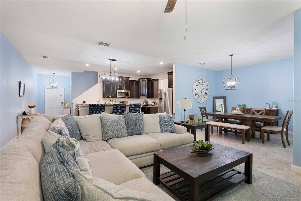 17365 Old Tobacco Road Lutz, FL 33558 - Photo 6 of 44 a living room with furniture kitchen view and a table