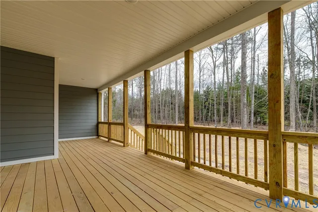 a view of balcony with wooden floor