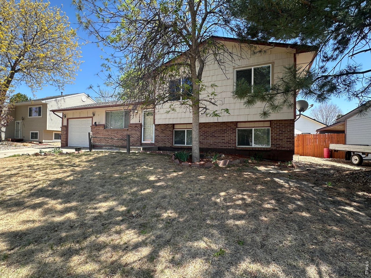 268 Fifth Street Firestone, CO 80520 - Photo 3 of 25 a view of a house with a yard
