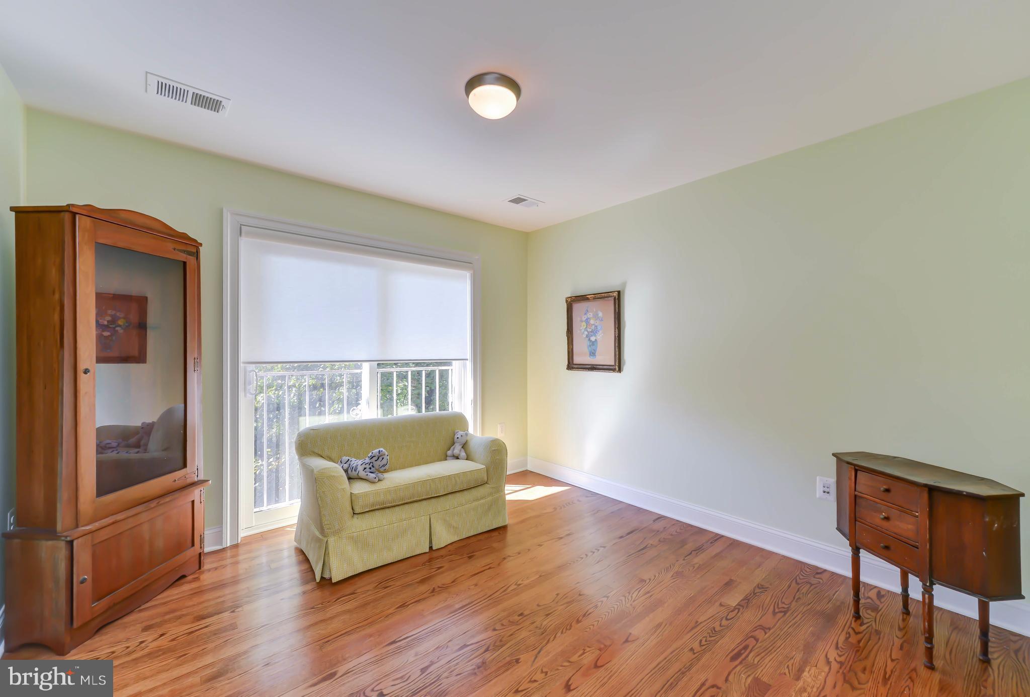 2126 Military Road Arlington, VA 22207 - Photo 24 of 29 a living room with couch and a wooden floor