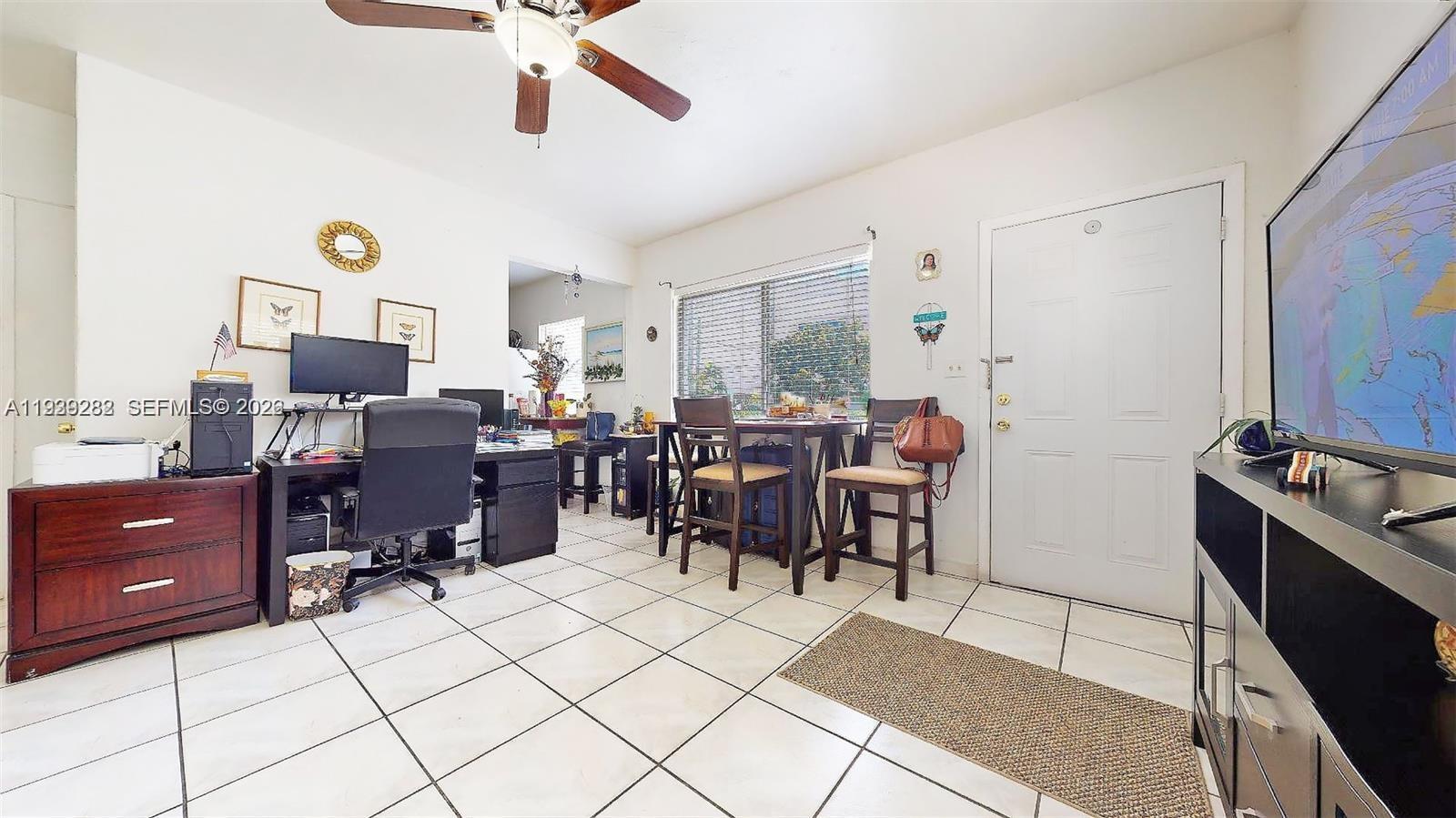 2499 Southwest 27th Street, Unit 1 Miami, FL 33133 - Photo 7 of 14 a view of a workspace with furniture