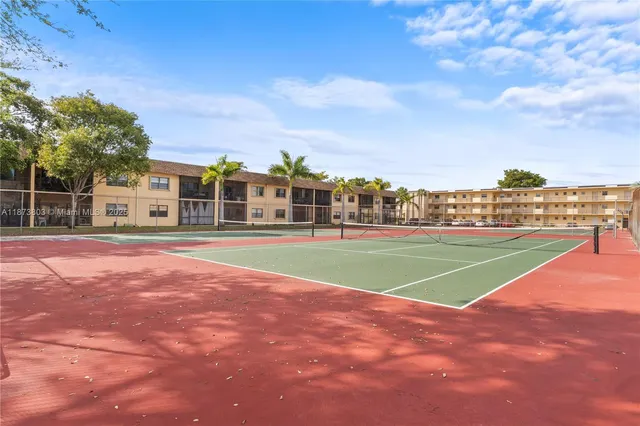 an aerial view of residential building and ocean view