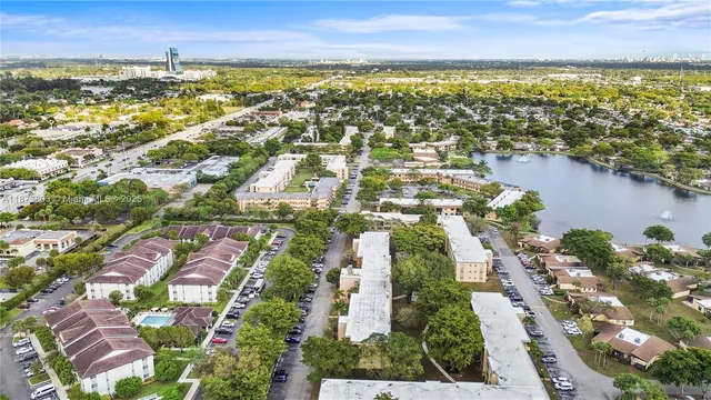an aerial view of residential building and lake