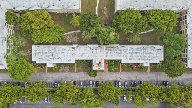 an aerial view of a house with outdoor space