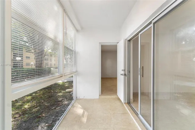 a view of a bathroom with a glass door