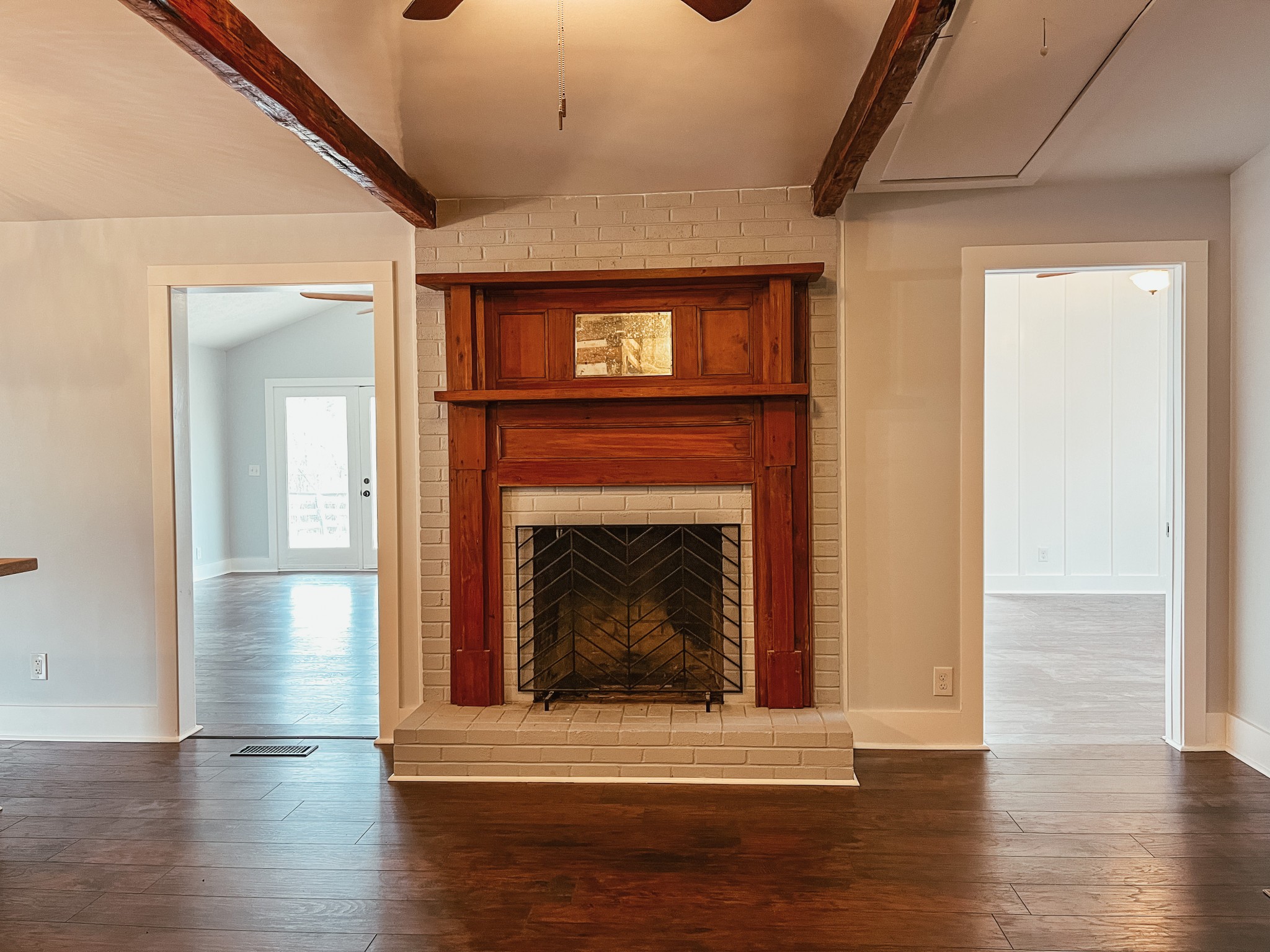 2410 Oregon Road Lascassas, TN 37085 - Photo 11 of 25 a living room with a fireplace and wooden floor
