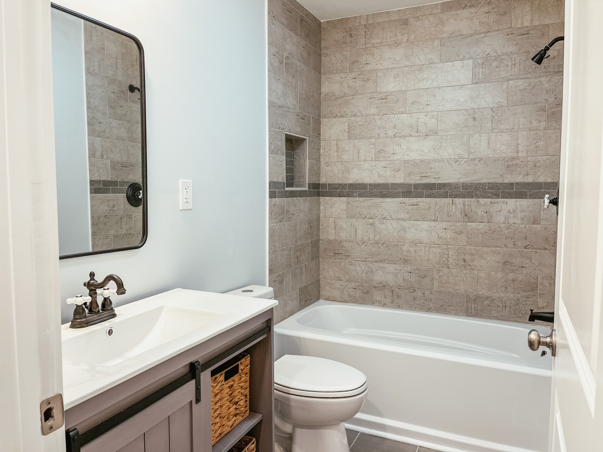 2410 Oregon Road Lascassas, TN 37085 - Photo 17 of 25 a bathroom with a sink a toilet and a bathtub