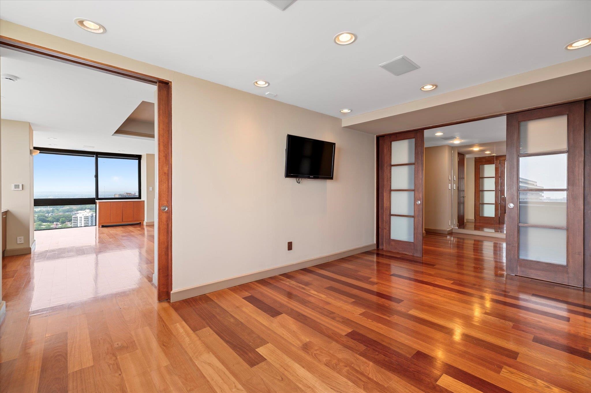 200 Old Palisade Road, Unit PH 4/5 Fort Lee, NJ 07024 - Photo 15 of 46 a view of empty room with wooden floor and fan