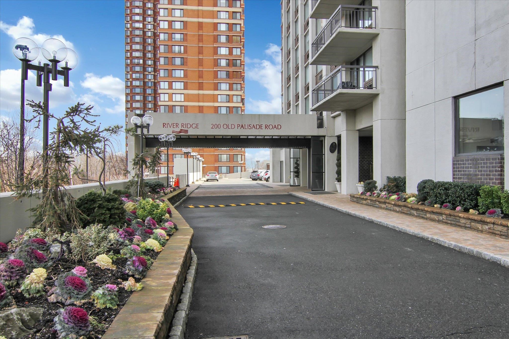 200 Old Palisade Road, Unit PH 4/5 Fort Lee, NJ 07024 - Photo 2 of 46 a front view of a building with flowers