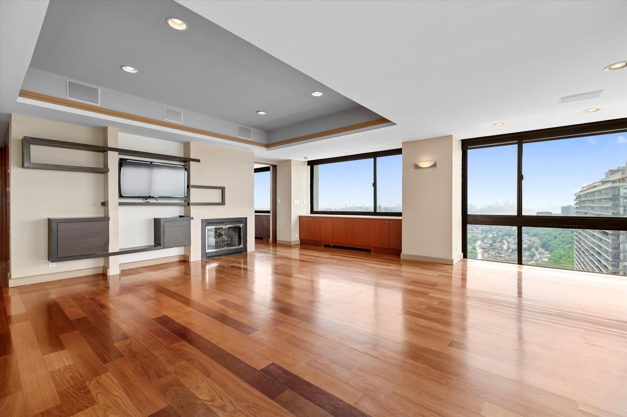 200 Old Palisade Road, Unit PH 4/5 Fort Lee, NJ 07024 - Photo 22 of 46 a living room with furniture and a wooden floor