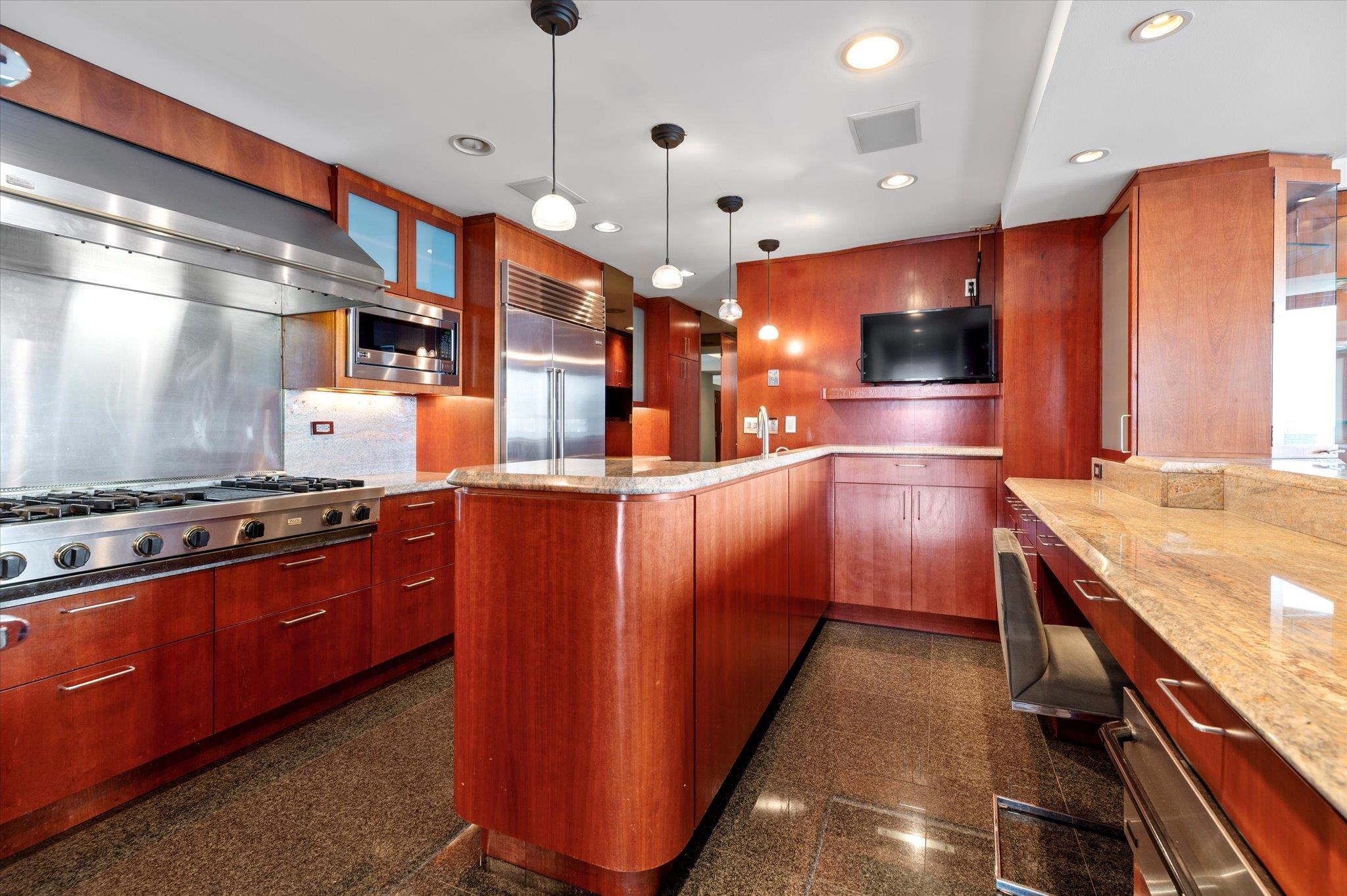 200 Old Palisade Road, Unit PH 4/5 Fort Lee, NJ 07024 - Photo 25 of 46 a kitchen with stainless steel appliances granite countertop a stove a sink and a refrigerator