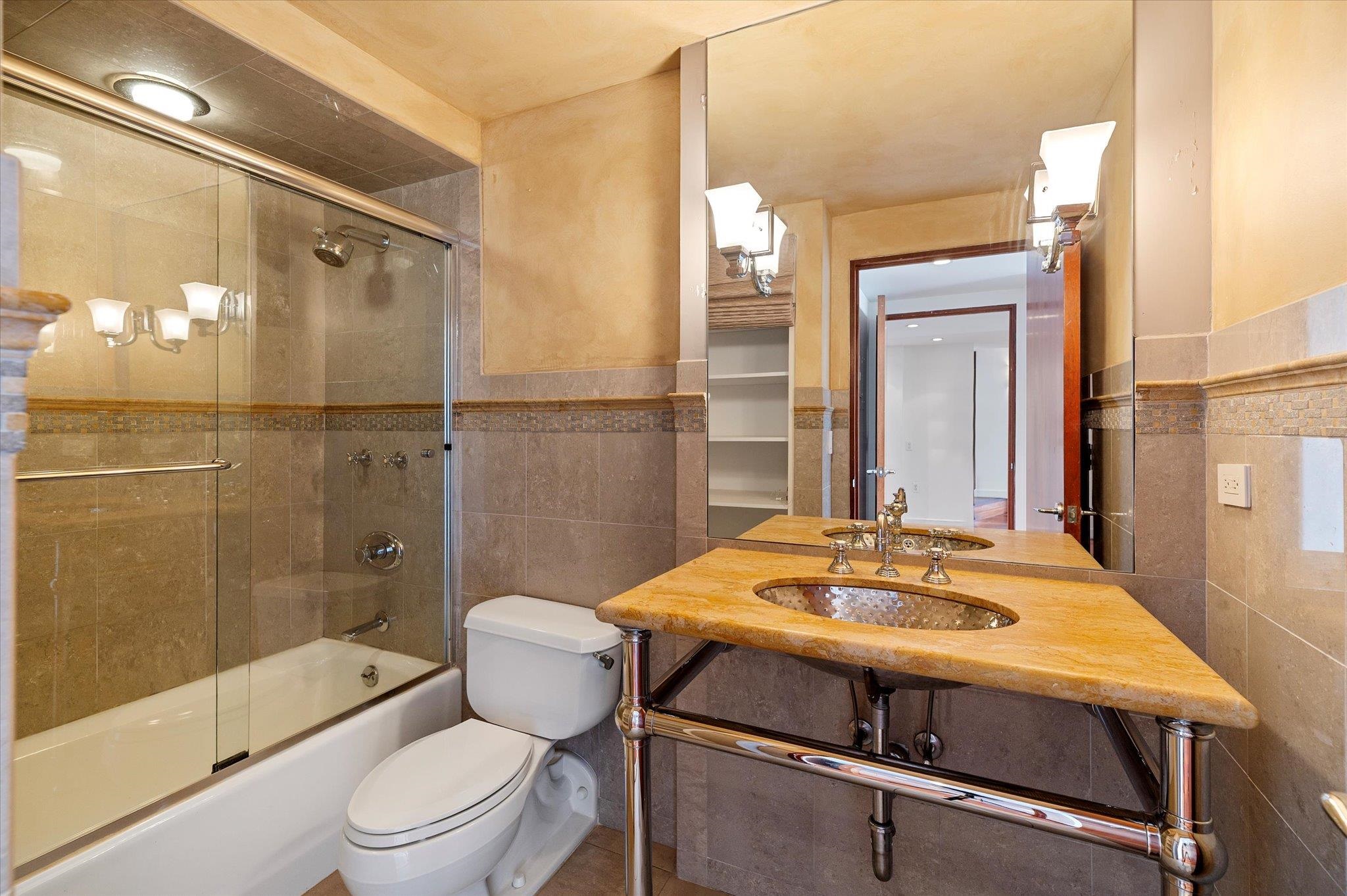 200 Old Palisade Road, Unit PH 4/5 Fort Lee, NJ 07024 - Photo 30 of 46 a bathroom with a sink a toilet and shower