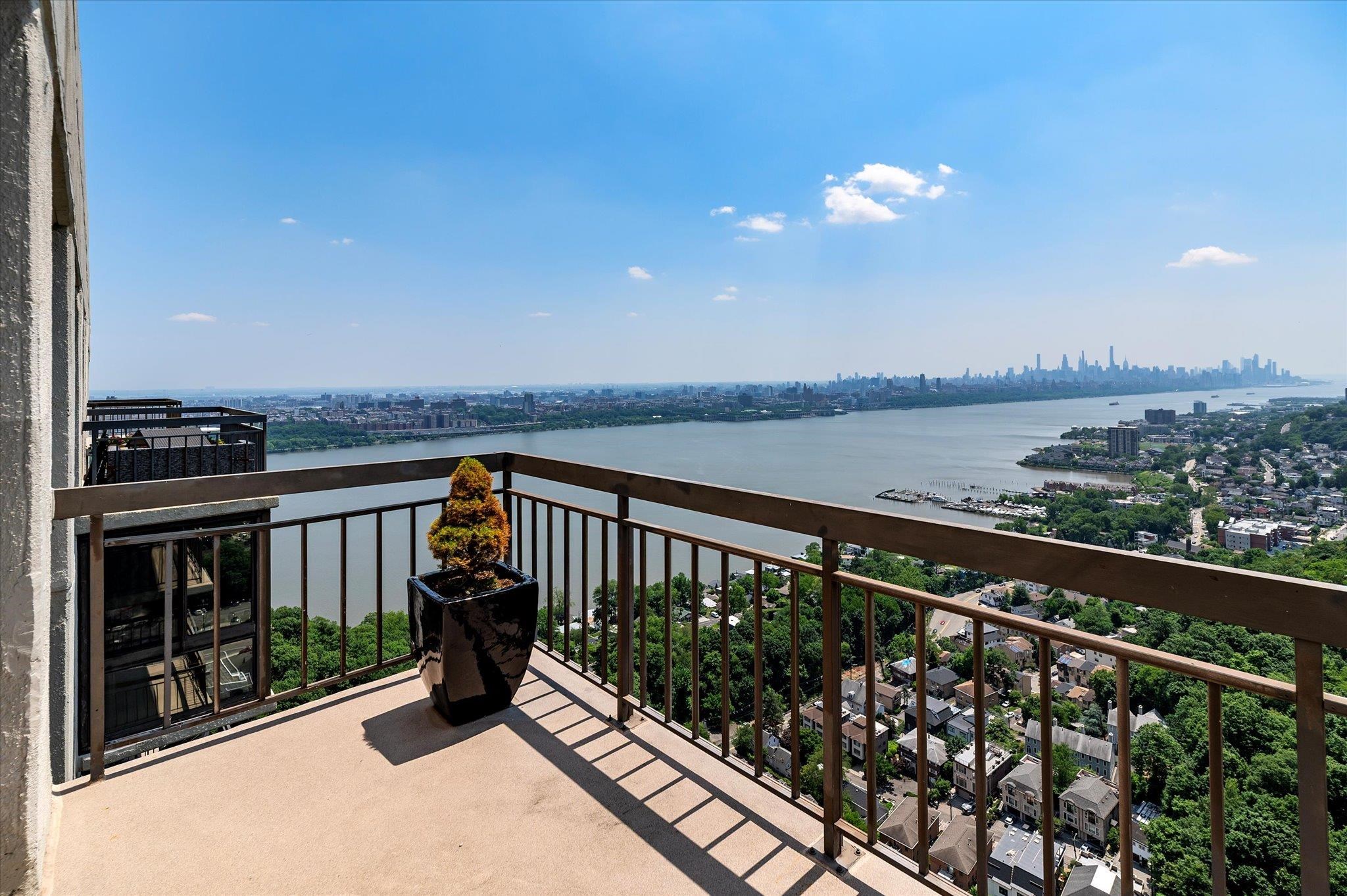 200 Old Palisade Road, Unit PH 4/5 Fort Lee, NJ 07024 - Photo 34 of 46 a view of a balcony with wooden floor