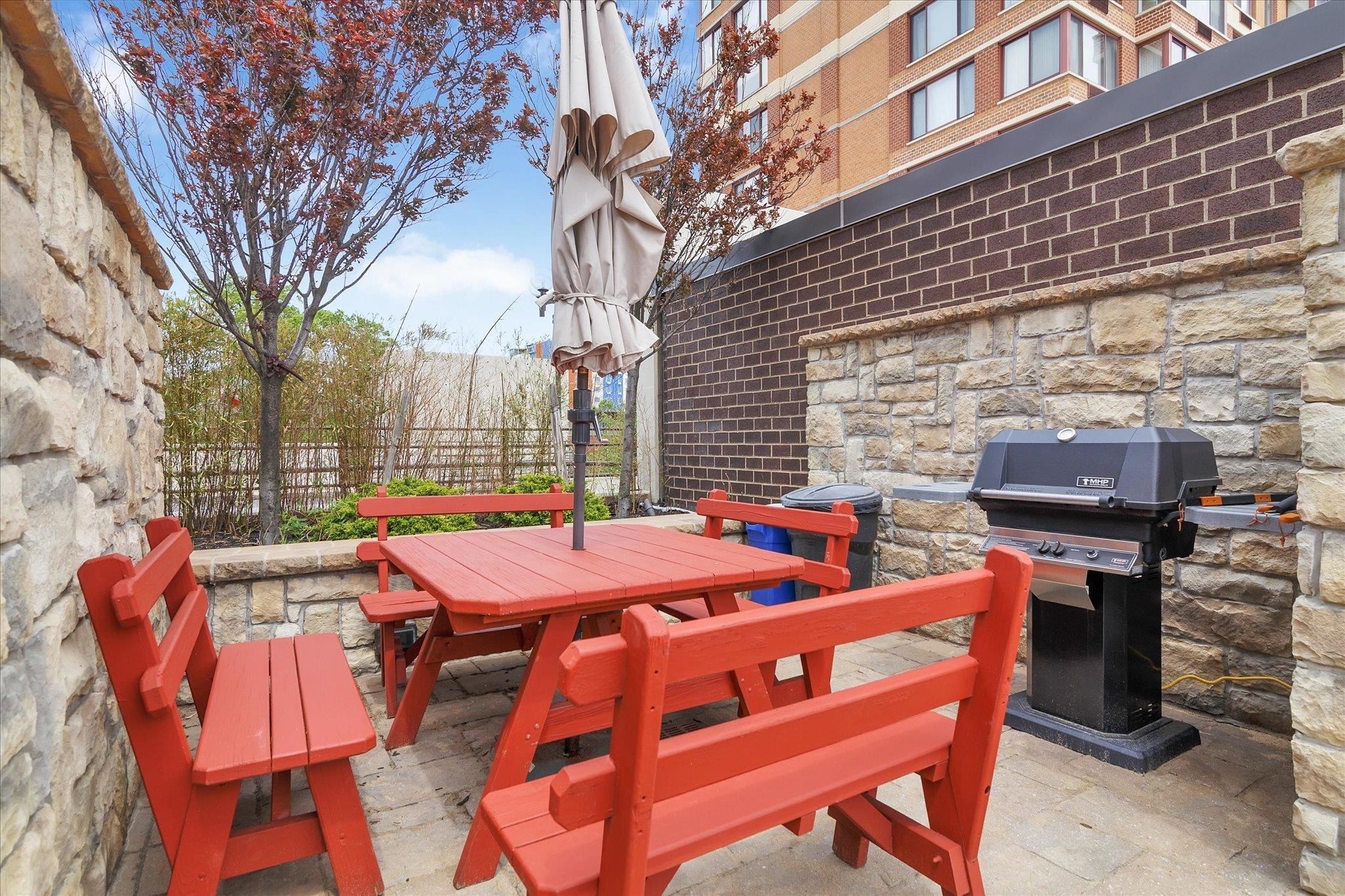 200 Old Palisade Road, Unit PH 4/5 Fort Lee, NJ 07024 - Photo 42 of 46 a table and chairs with the wooden floor