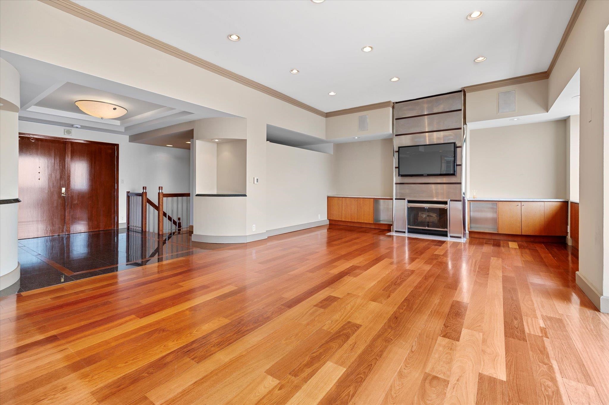 200 Old Palisade Road, Unit PH 4/5 Fort Lee, NJ 07024 - Photo 5 of 46 a view of kitchen with furniture and wooden floor