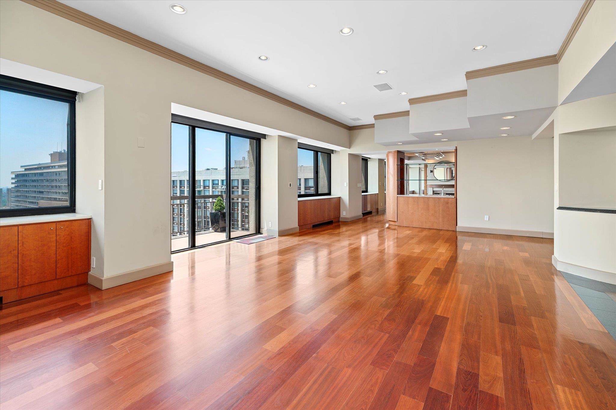 200 Old Palisade Road, Unit PH 4/5 Fort Lee, NJ 07024 - Photo 6 of 46 a view of an empty room with wooden floor and a window