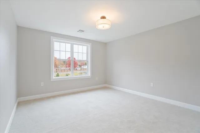 an empty room with windows and window