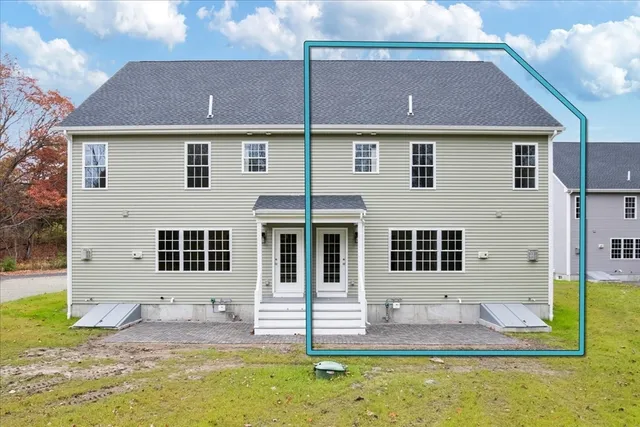 a front view of a house with a yard and outdoor seating