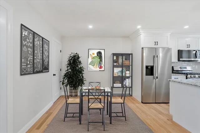 a view of a dining room with furniture and window