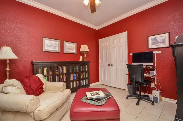 a living room with furniture a rug and a window