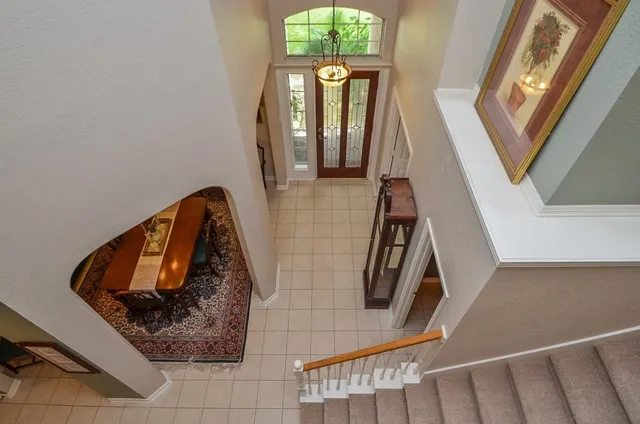 a view of an entryway with wooden floor