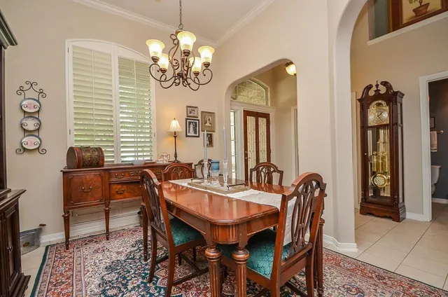 a dining room with furniture and window