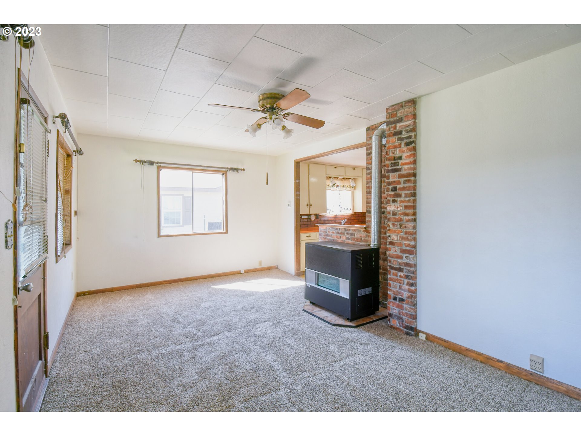 617 Southwest 5th Street Pendleton, OR 97801 - Photo 5 of 29 a view of empty room with a fireplace and fan