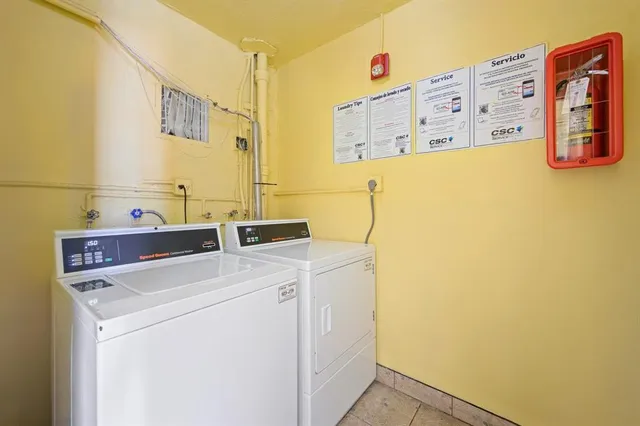 a utility room with dryer and washer
