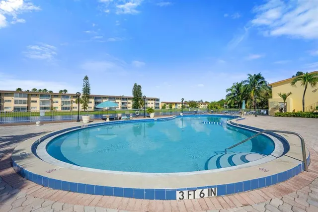 a view of a swimming pool with a terrace