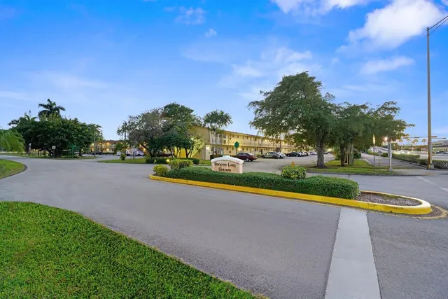 a view of a lake with a house in the background