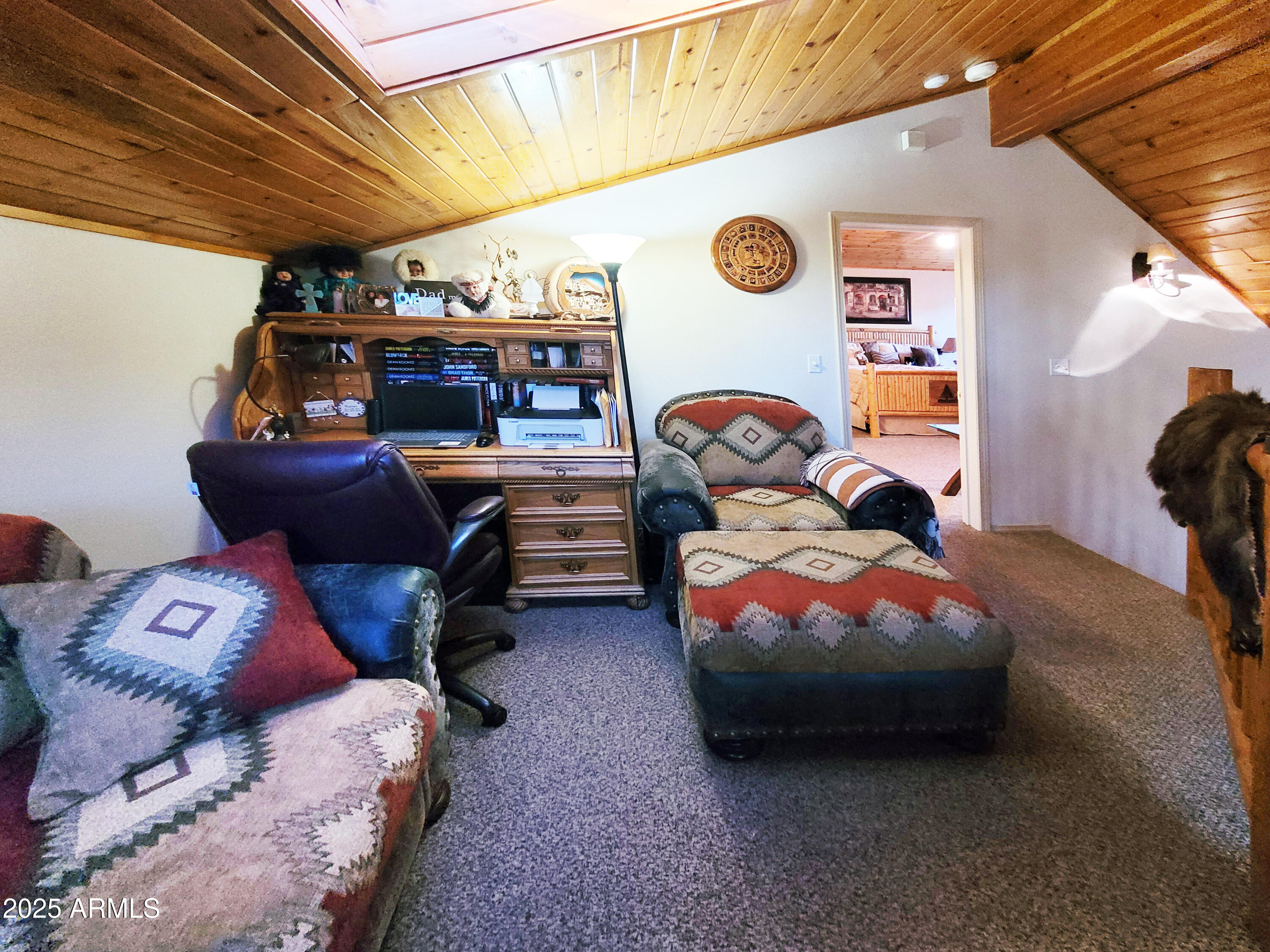 5579 Solitude Trail Loop Pine, AZ 85544 - Photo 27 of 50 a bed room with furniture and a clock