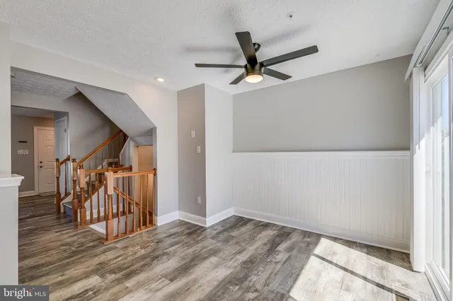 a view of a room with wooden floor