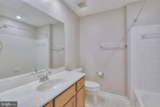 a bathroom with a sink toilet and vanity