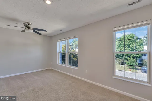 a view of a room with windows