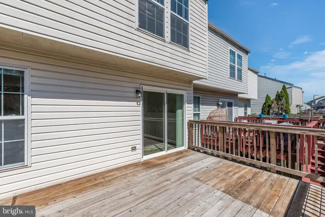 a view of a house with wooden deck