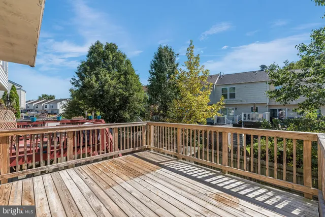 a view of wooden deck and a yard