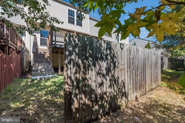 a view of a pathway of a house with a tree