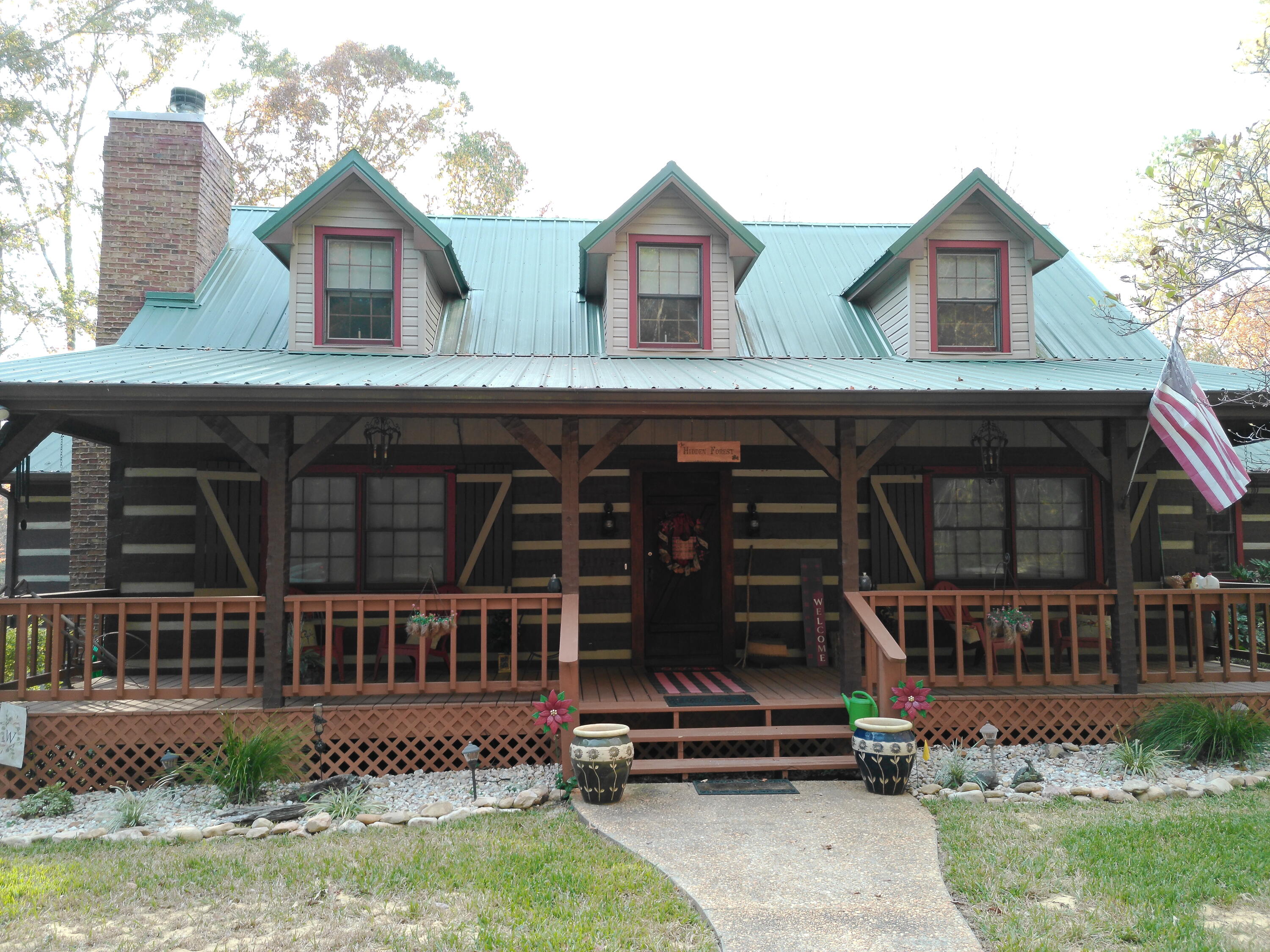 25278 Hidden Forest Lane Andalusia, AL 36421 - Photo 1 of 35 a front view of a house with garden