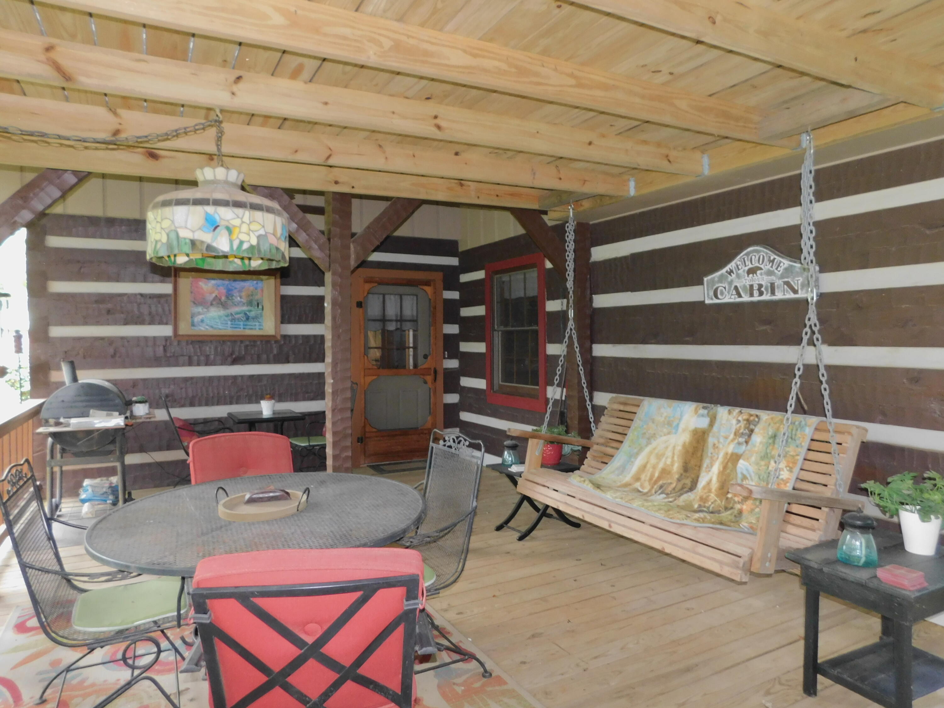 25278 Hidden Forest Lane Andalusia, AL 36421 - Photo 11 of 35 a living room with furniture and a chandelier