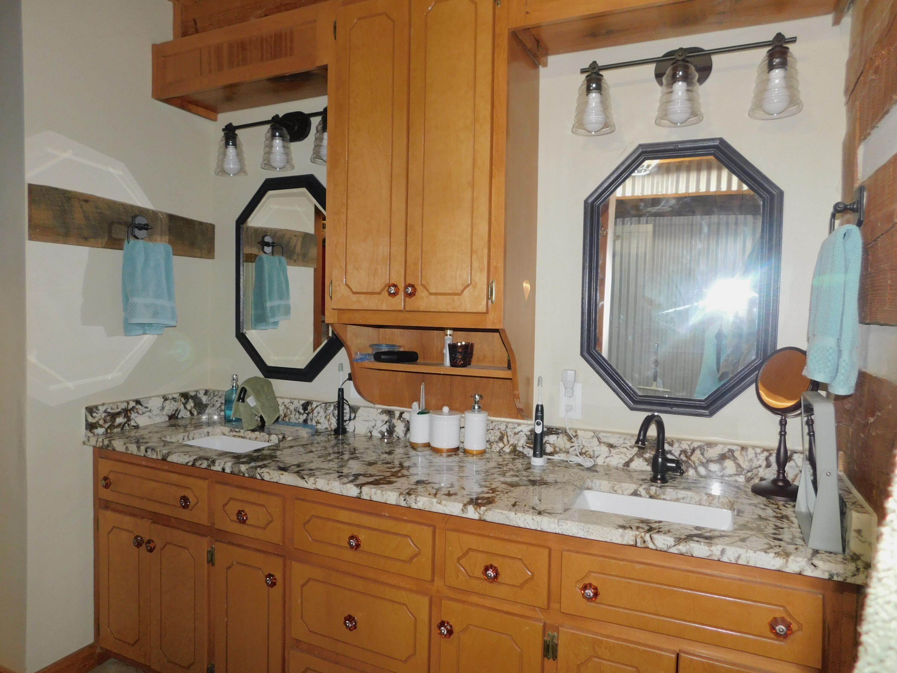 25278 Hidden Forest Lane Andalusia, AL 36421 - Photo 21 of 35 a bathroom with a sink and a mirror