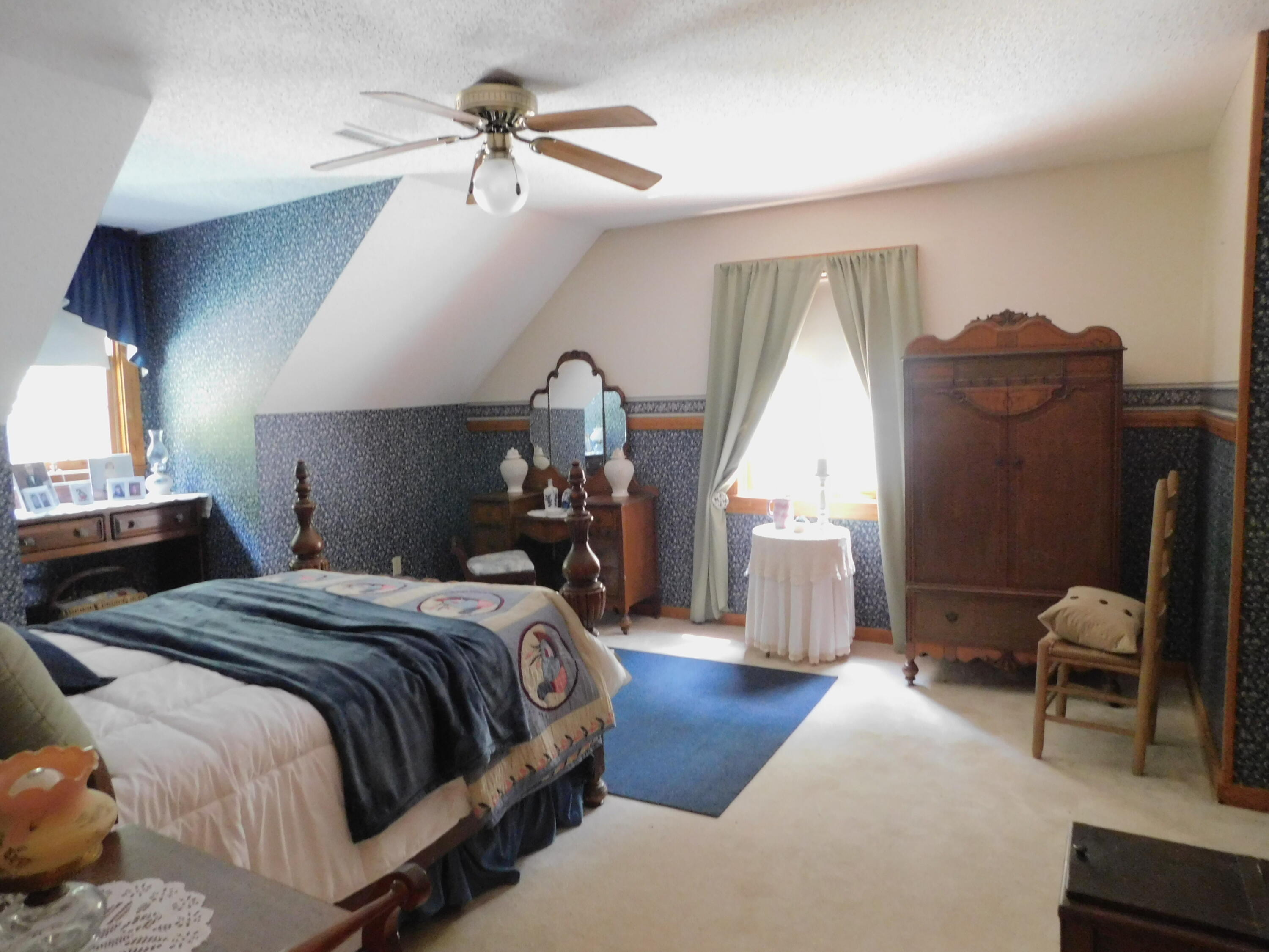 25278 Hidden Forest Lane Andalusia, AL 36421 - Photo 23 of 35 a bedroom with bed and a chandelier