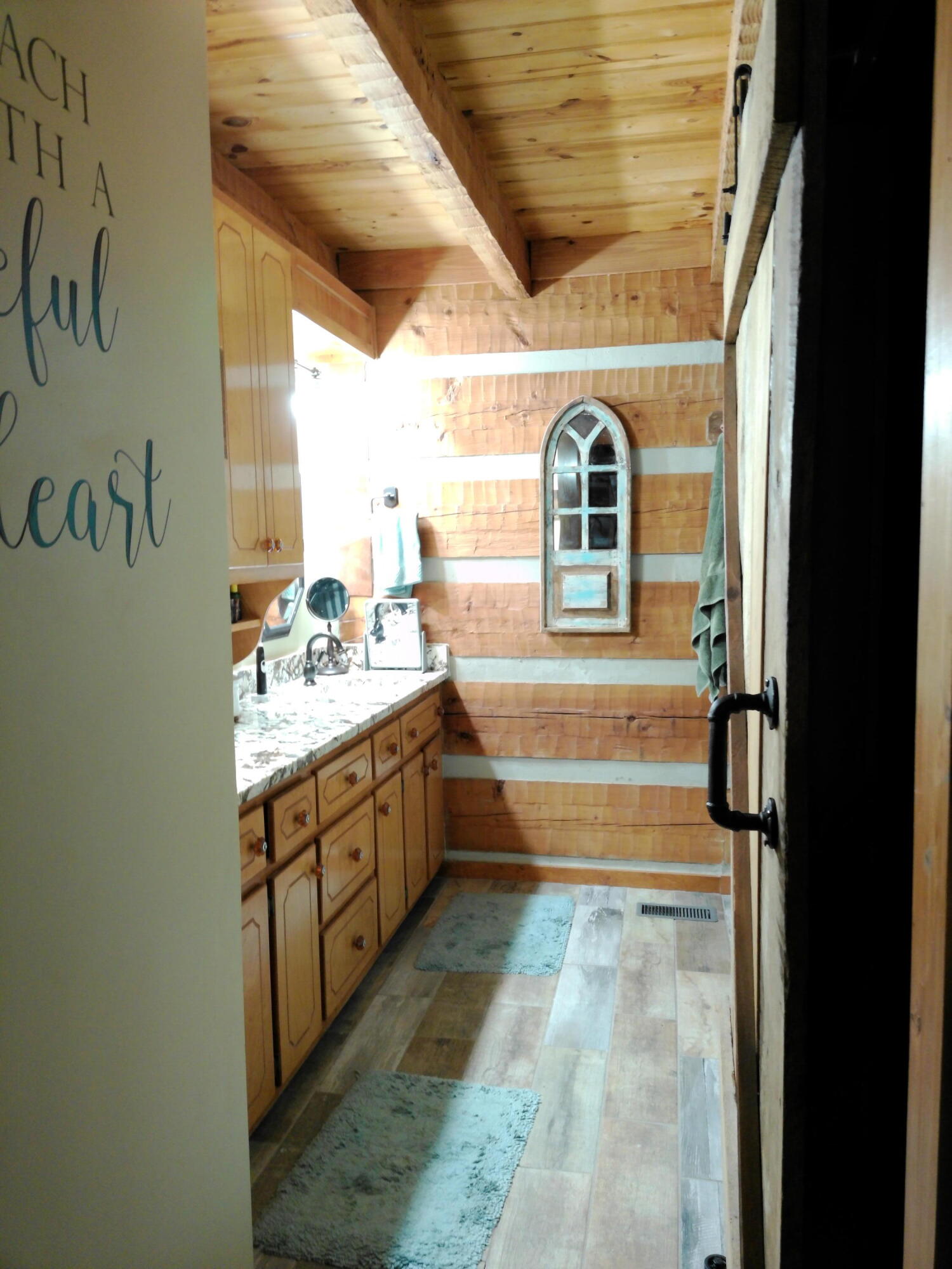 25278 Hidden Forest Lane Andalusia, AL 36421 - Photo 34 of 35 a bathroom with a double vanity sink a mirror and a bathtub