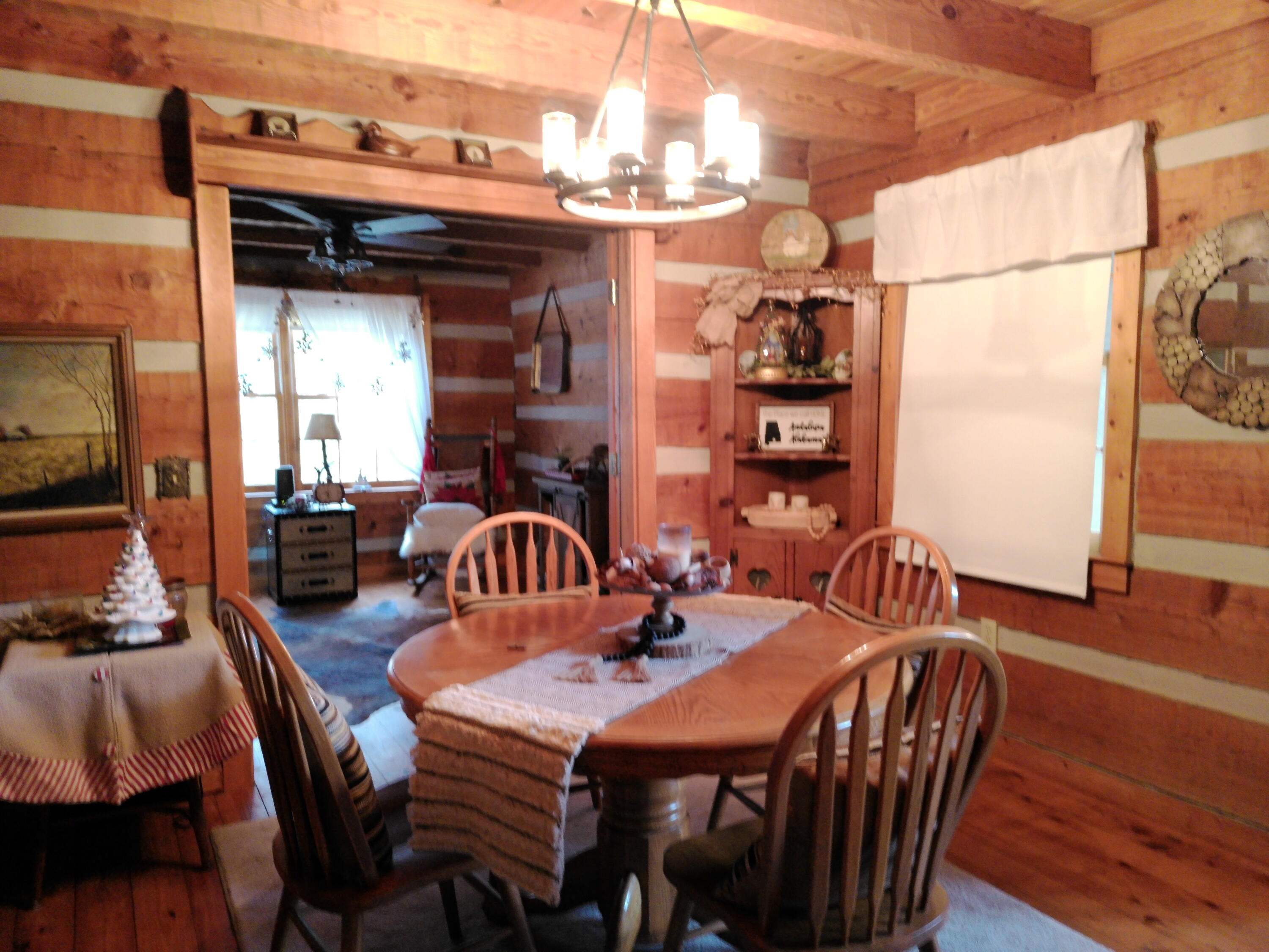 25278 Hidden Forest Lane Andalusia, AL 36421 - Photo 7 of 35 a view of a a dining room with furniture window and wooden floor