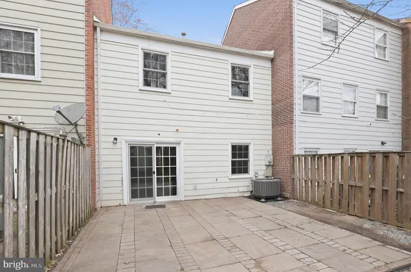 a view of backyard with large windows