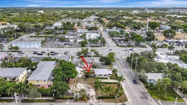 an aerial view of residential houses with outdoor space and street view