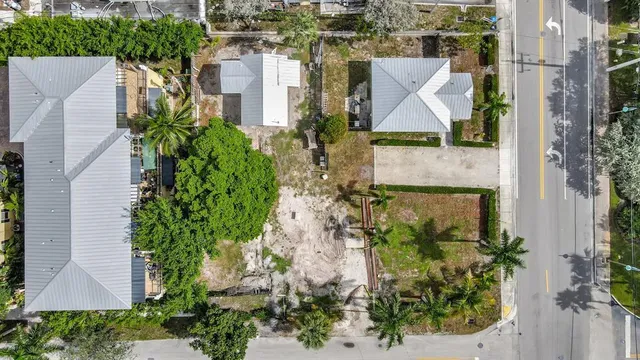an aerial view of a house with a garden and plants