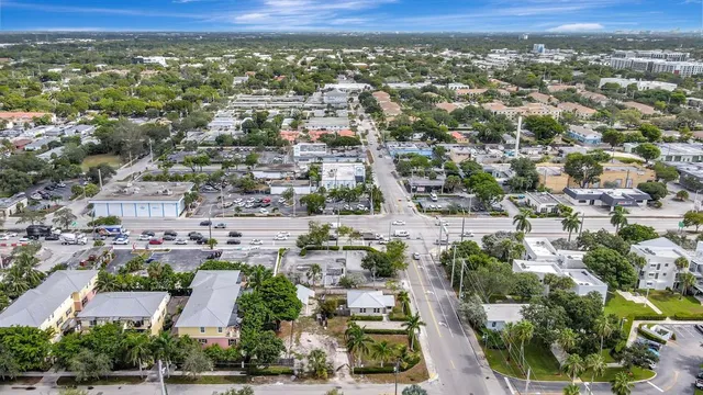 an aerial view of residential houses with city view