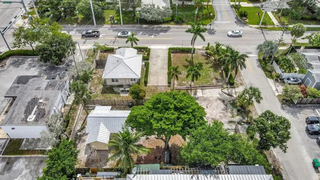 an aerial view of multiple houses with yard