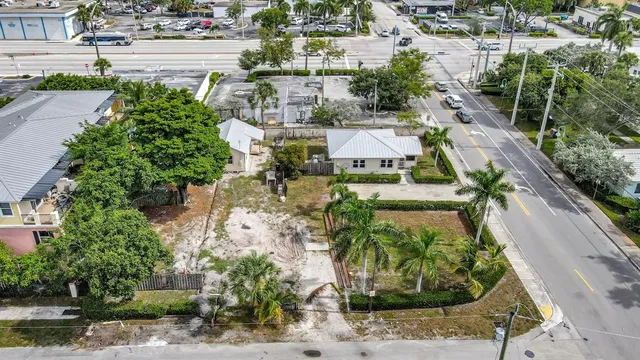 an aerial view of a house with a garden and plants